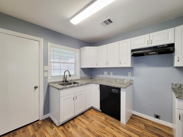 kitchen with white cabinetry, sink, light stone countertops, and dishwasher