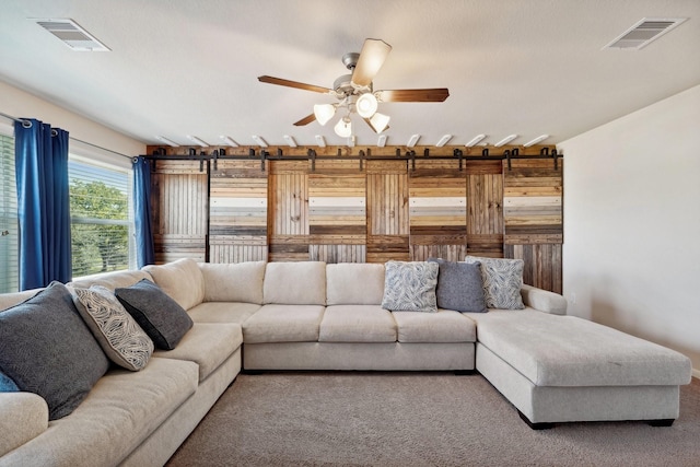 living room with carpet floors and ceiling fan