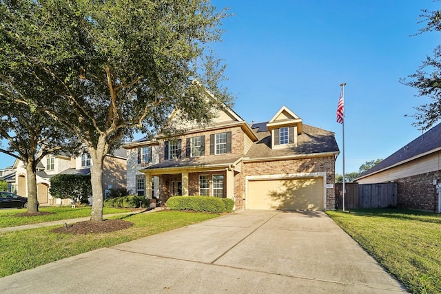 view of front of home with a garage and a front lawn