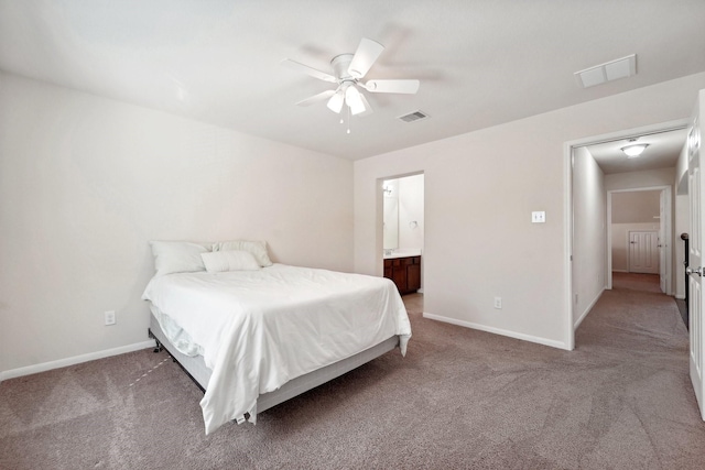 bedroom featuring ceiling fan, carpet floors, and ensuite bathroom