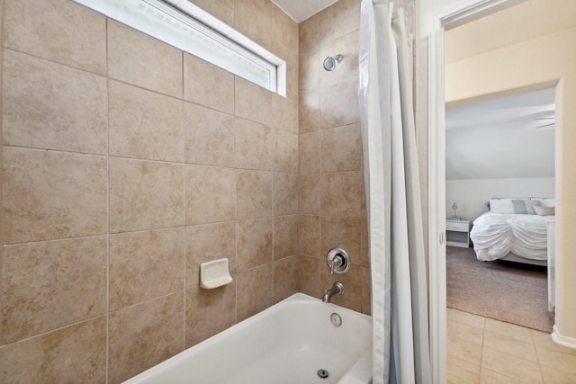 bathroom with shower / bath combo and tile patterned floors