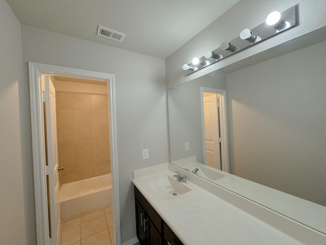 bathroom with tile patterned flooring and vanity