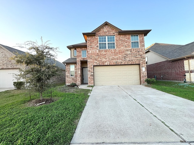 view of property with a garage and a front lawn