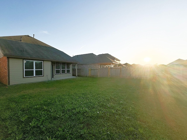 view of yard at dusk