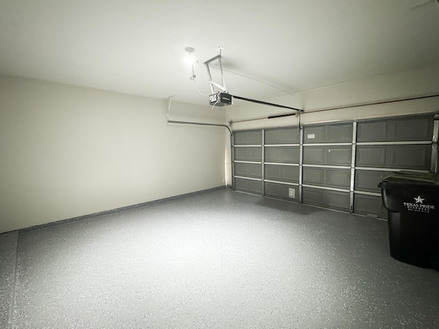 garage featuring a garage door opener