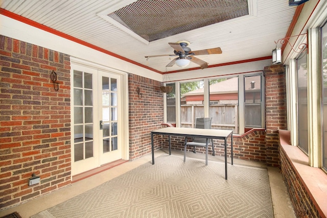 sunroom featuring ceiling fan and french doors