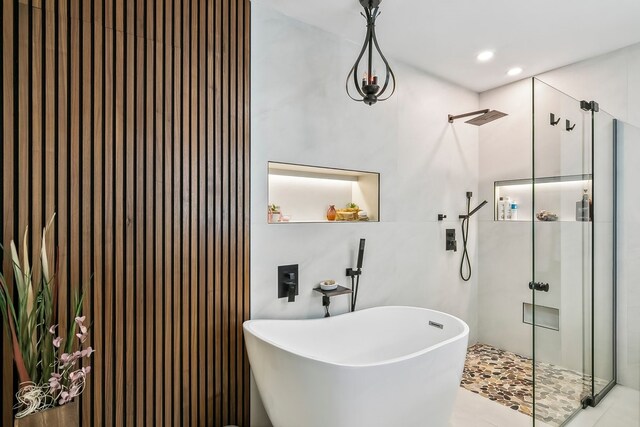 full bath with a freestanding tub, a stall shower, and recessed lighting