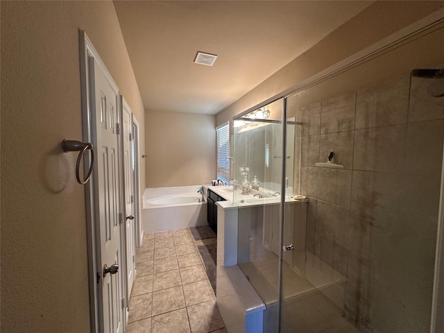 full bathroom featuring a shower stall, a garden tub, tile patterned floors, vanity, and visible vents