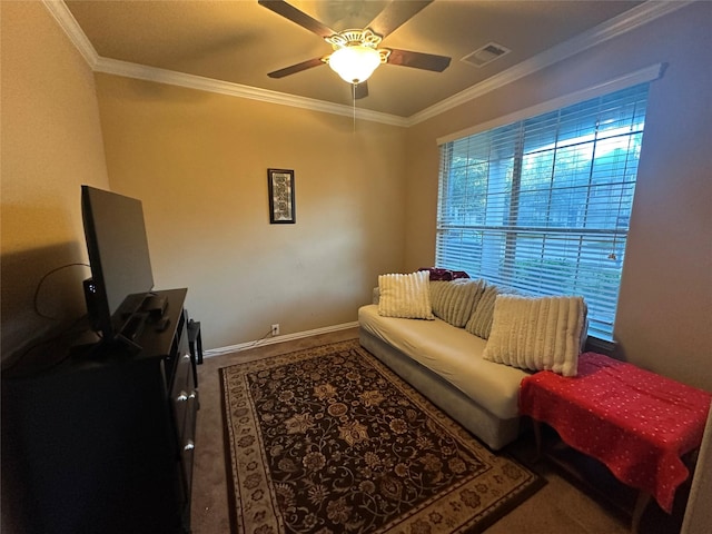 living room with carpet floors, visible vents, crown molding, and ceiling fan