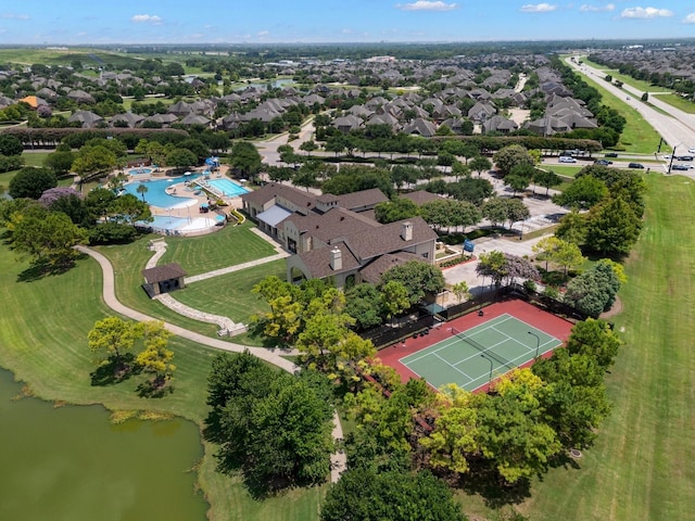 drone / aerial view with a water view and a residential view