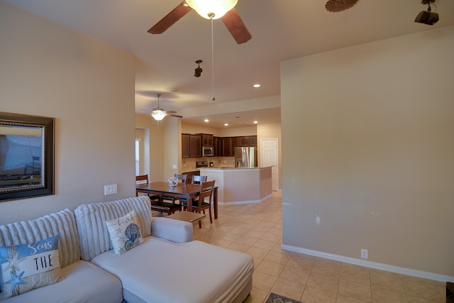 tiled living room with ceiling fan