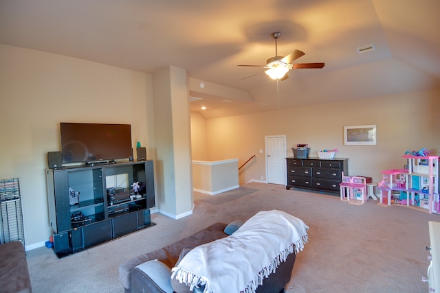 carpeted bedroom featuring lofted ceiling, baseboards, visible vents, and ceiling fan