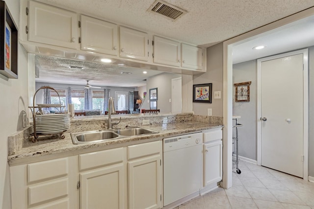 kitchen featuring ceiling fan, white dishwasher, a textured ceiling, and sink