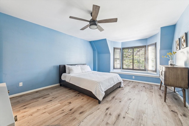 bedroom with light hardwood / wood-style flooring and ceiling fan