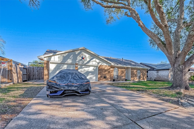 view of front of house with a front yard and a garage