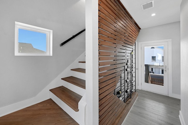 stairs featuring wood-type flooring