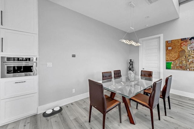 dining area with light wood-type flooring