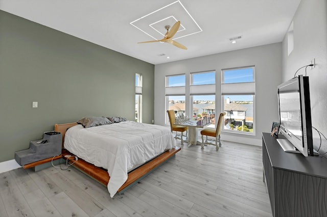 bedroom featuring ceiling fan and light hardwood / wood-style floors