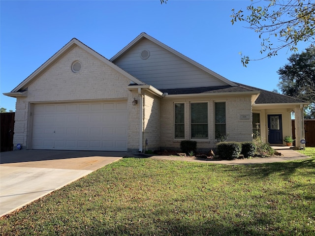 view of front facade with a garage and a front yard