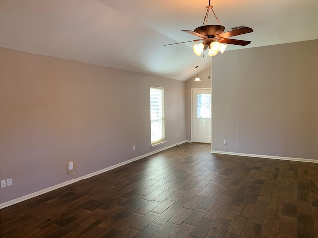 unfurnished room featuring ceiling fan, dark hardwood / wood-style floors, and lofted ceiling