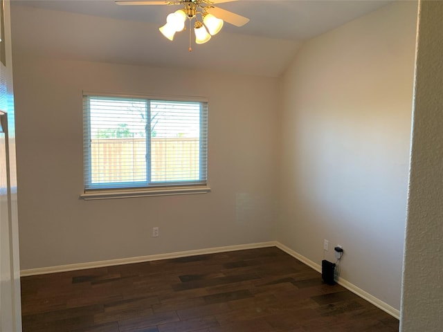 empty room featuring ceiling fan, dark hardwood / wood-style flooring, and lofted ceiling