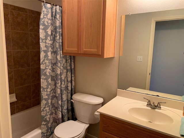 full bathroom featuring shower / bath combination with curtain, vanity, and toilet