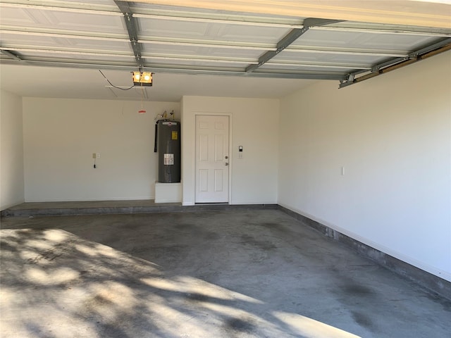 garage featuring electric water heater and a garage door opener