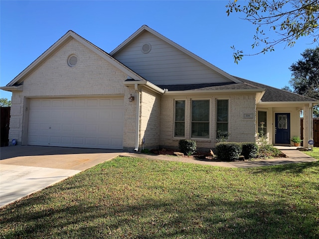 view of front of house with a garage and a front yard