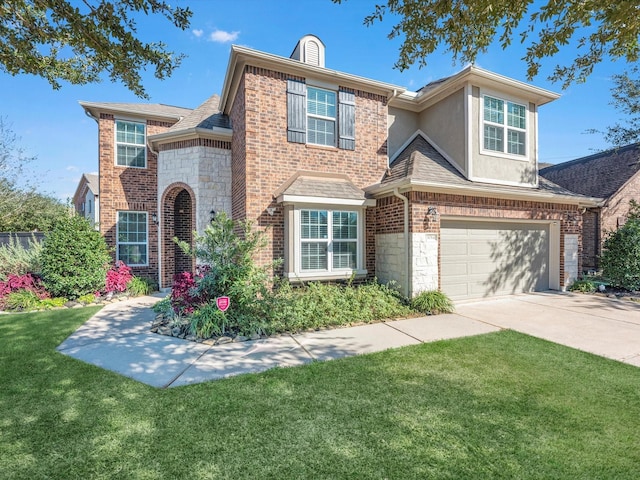 view of front of house featuring a front lawn and a garage