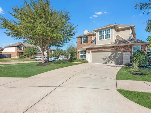 view of front of house featuring a front yard and a garage