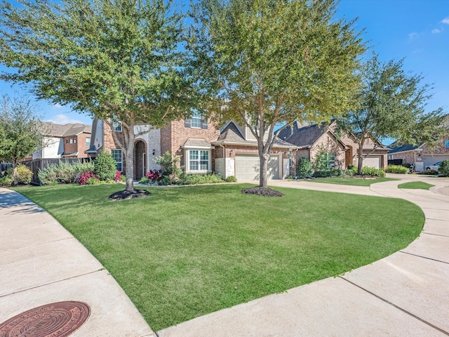 view of front of home featuring a garage and a front lawn