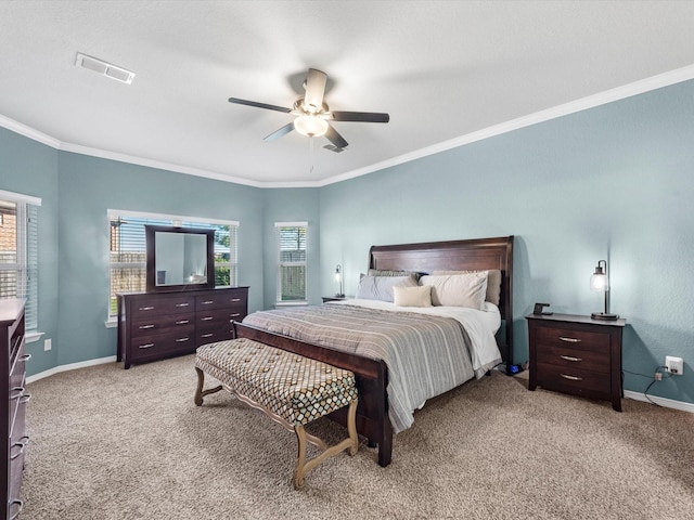 bedroom featuring ceiling fan, crown molding, and light carpet