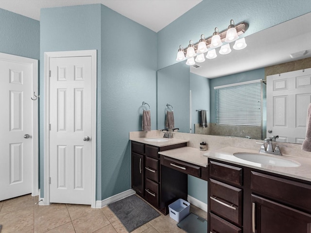 bathroom with tile patterned flooring and vanity