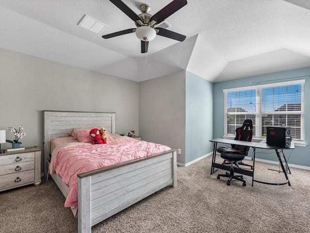 carpeted bedroom featuring a textured ceiling, a raised ceiling, ceiling fan, and lofted ceiling