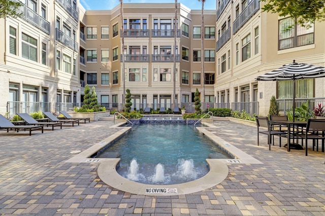 view of pool featuring pool water feature