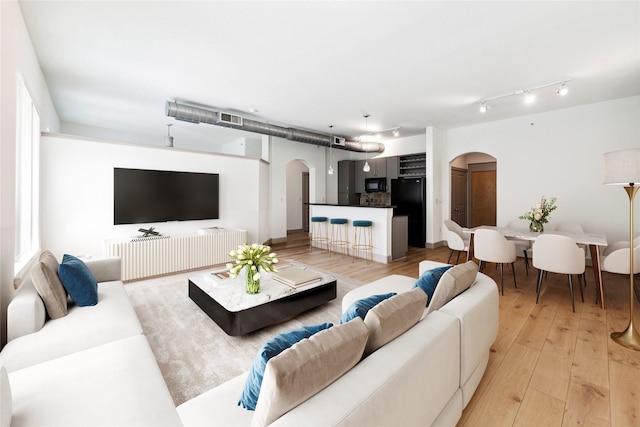 living room with light hardwood / wood-style floors