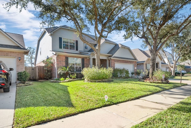 view of front of property with a front yard and a garage