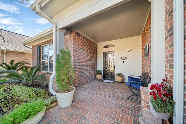 property entrance featuring covered porch