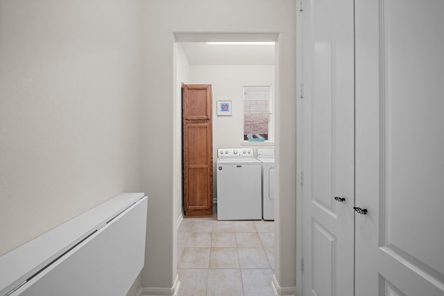 laundry area featuring light tile patterned flooring and independent washer and dryer