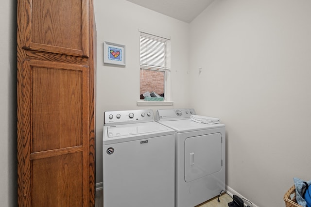 clothes washing area featuring washer and dryer