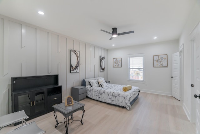 bedroom with ceiling fan and light hardwood / wood-style flooring