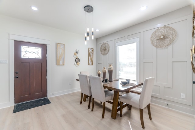 dining area with light hardwood / wood-style floors