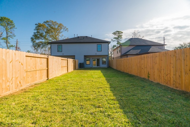 rear view of property featuring a yard