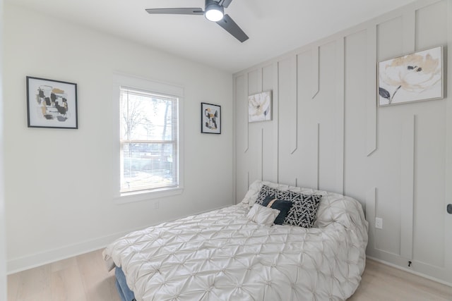 bedroom with light hardwood / wood-style flooring and ceiling fan