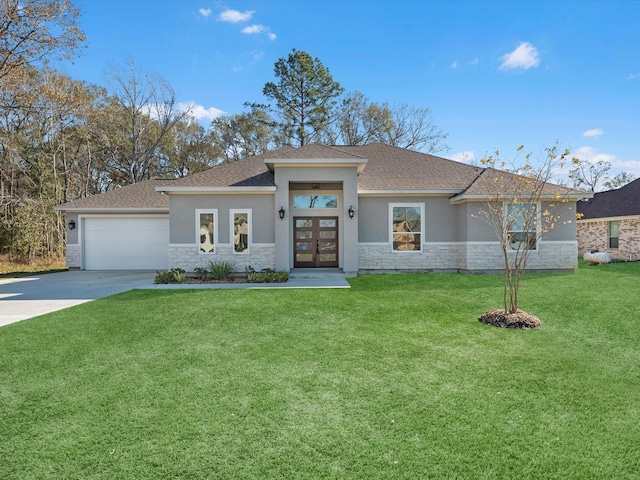 view of front of property with a front lawn, a garage, and french doors