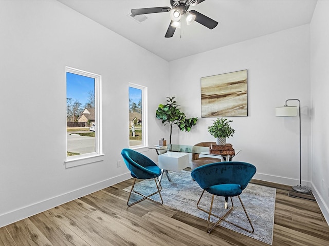 sitting room with hardwood / wood-style flooring and ceiling fan