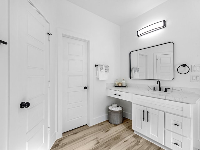 bathroom featuring vanity and wood-type flooring