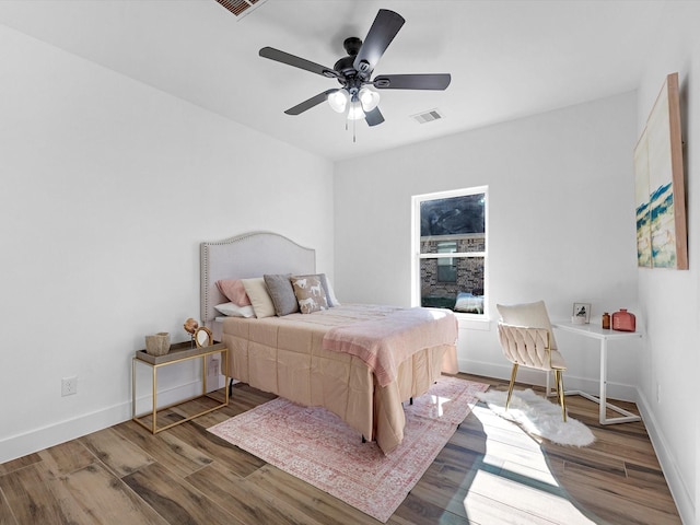 bedroom featuring ceiling fan and wood-type flooring