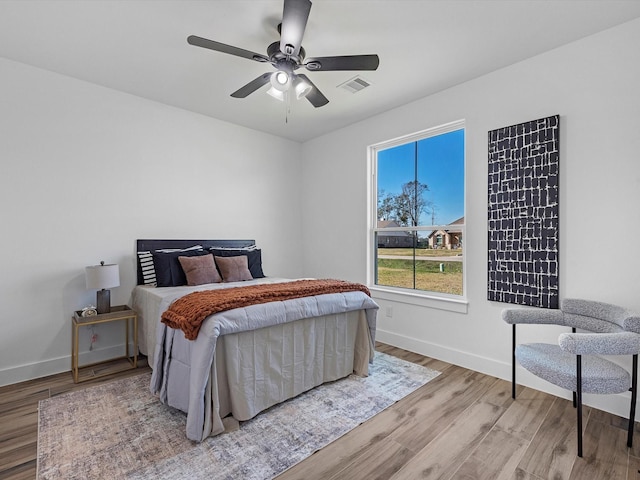 bedroom featuring ceiling fan and light wood-type flooring