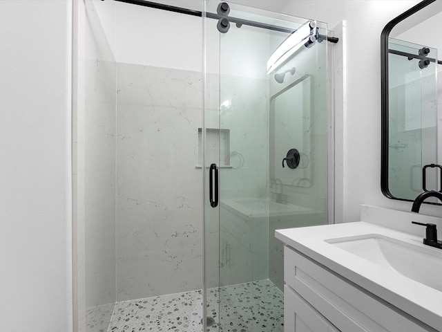 bathroom with vanity and an enclosed shower